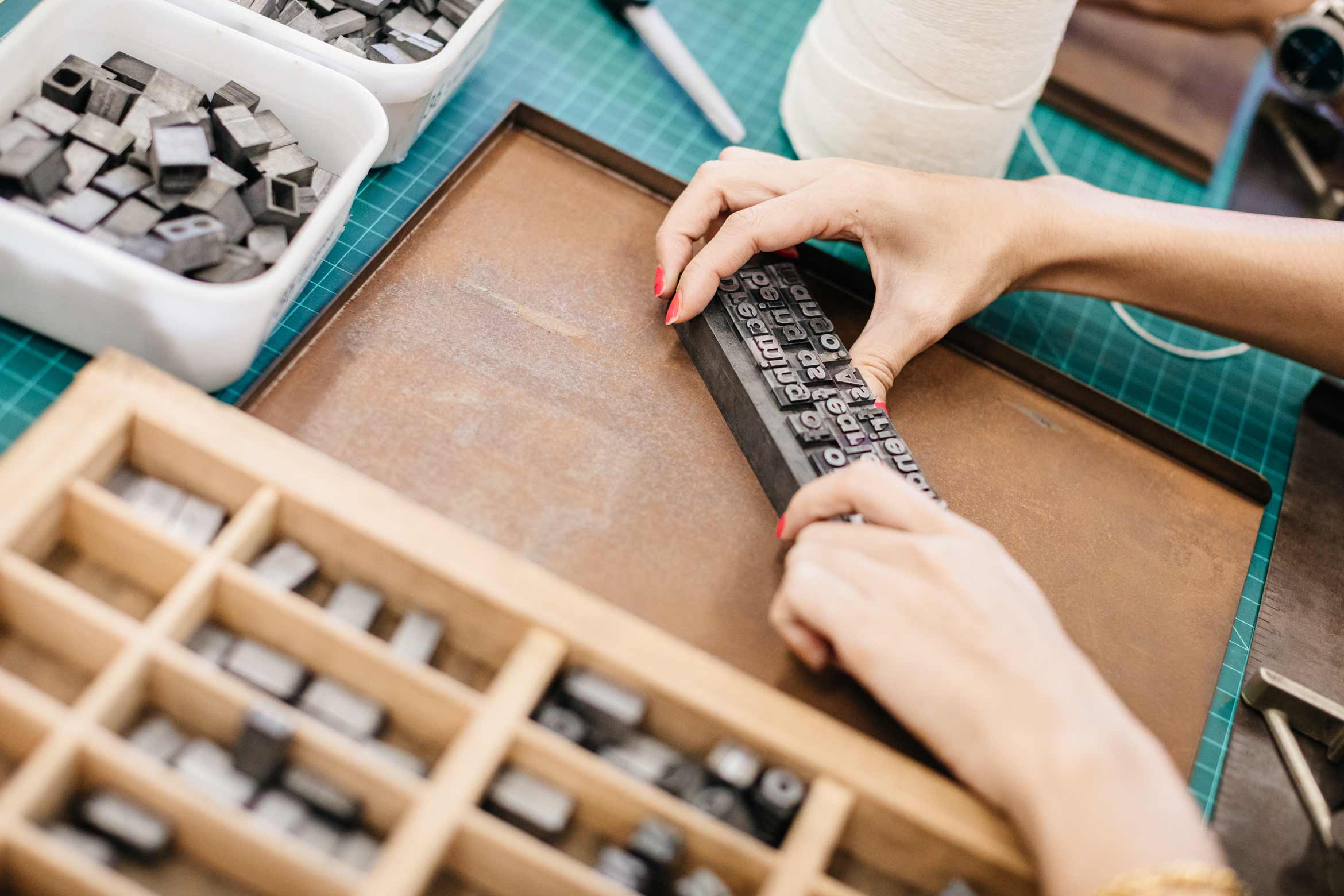 student doing typesetting for a manual press